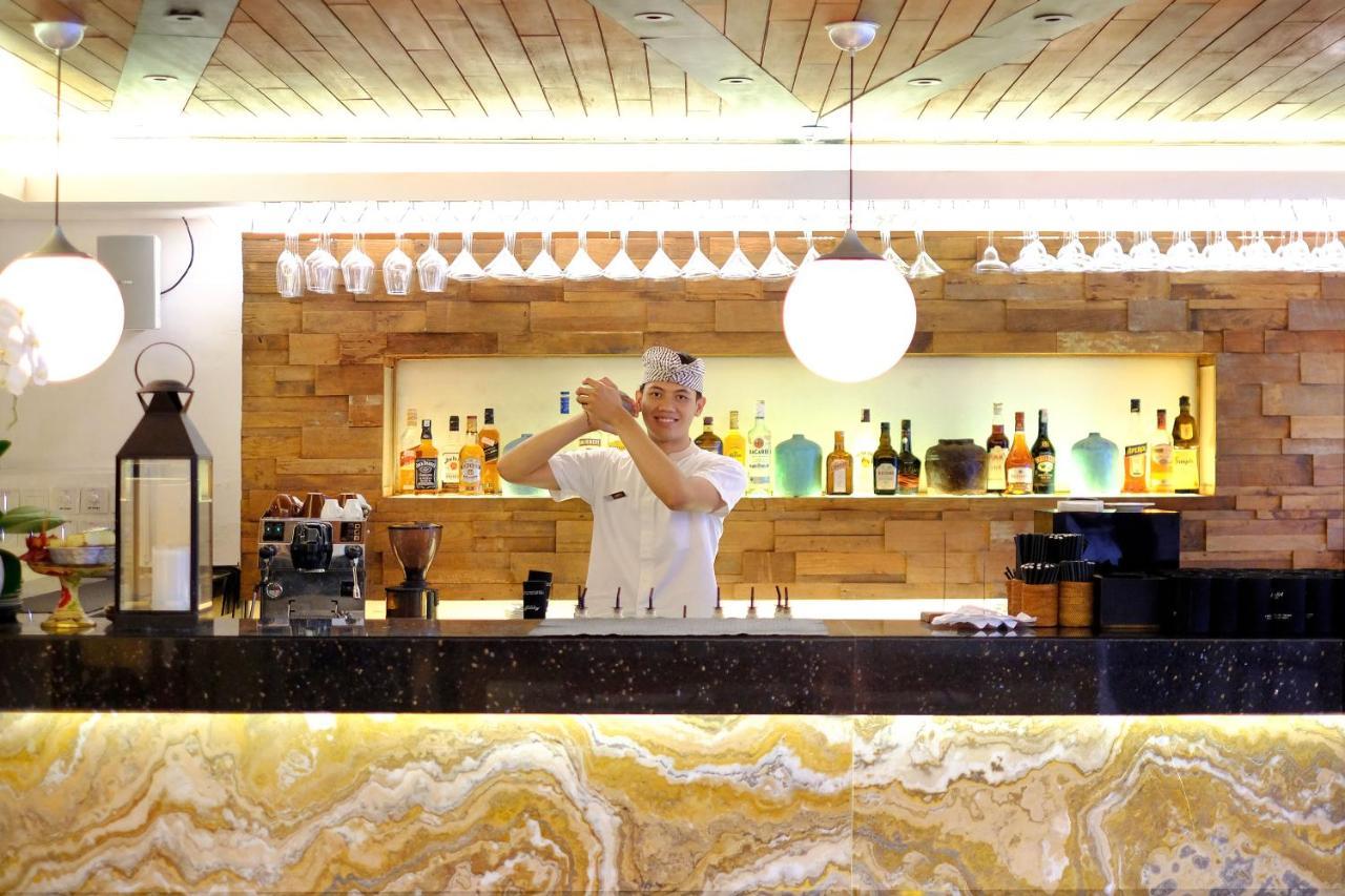 The Magani Hotel And Spa Legian  Exterior photo A bartender at work